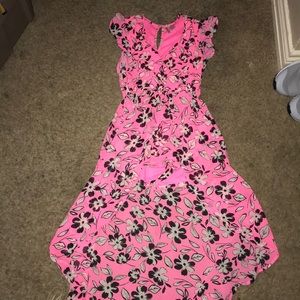 Hot pink dress with black and white flowers on it